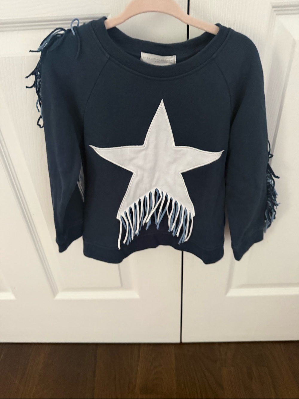 Stella McCartney- Navy blue girls sweater with fringes.
